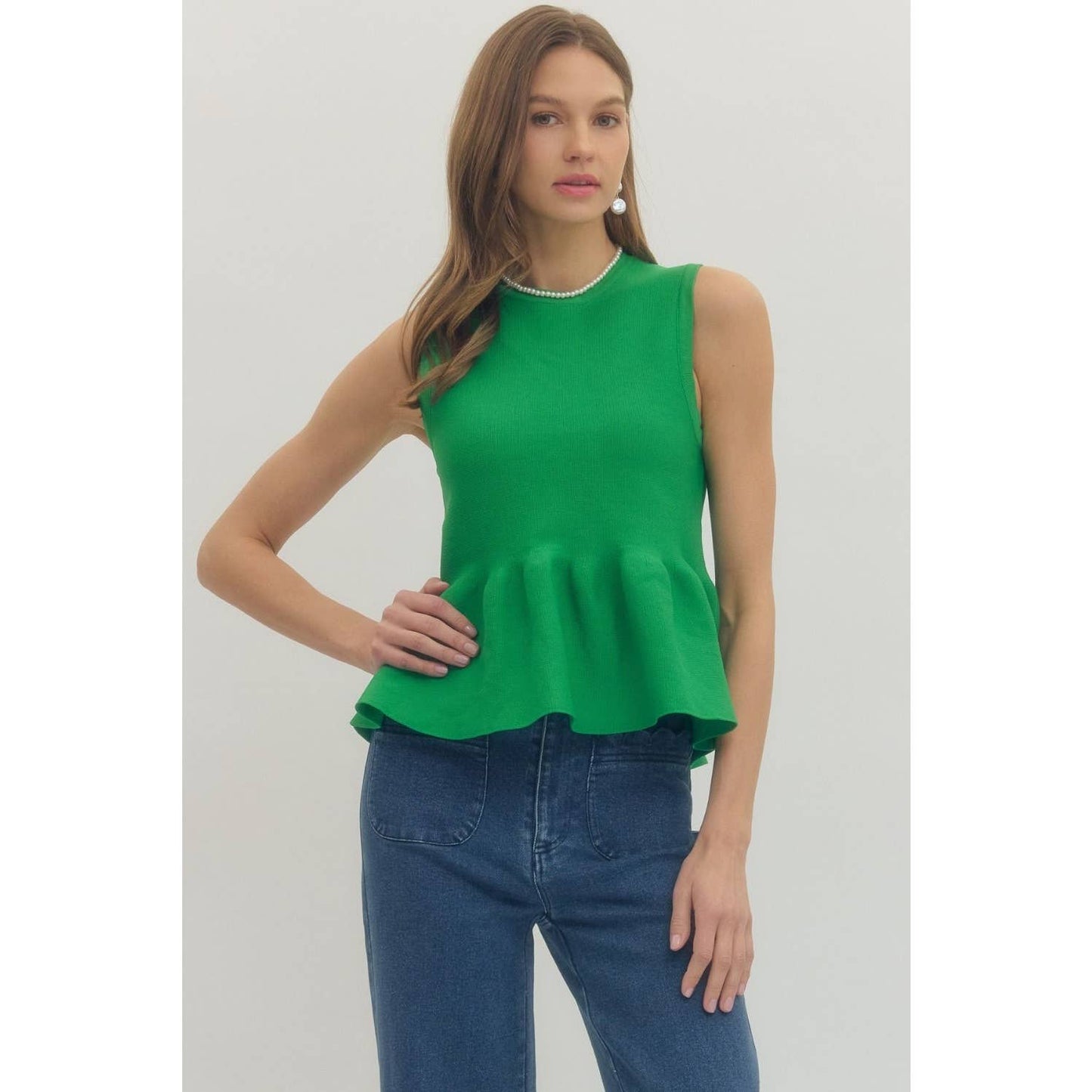 Solid sleeveless peplum top